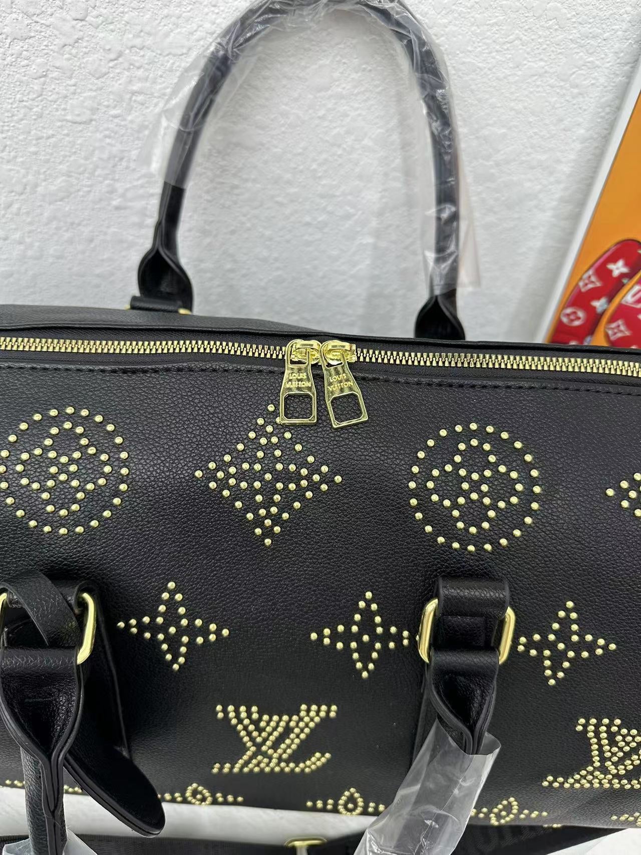 Louis vuitton handbag ( weekender / traveling bag)