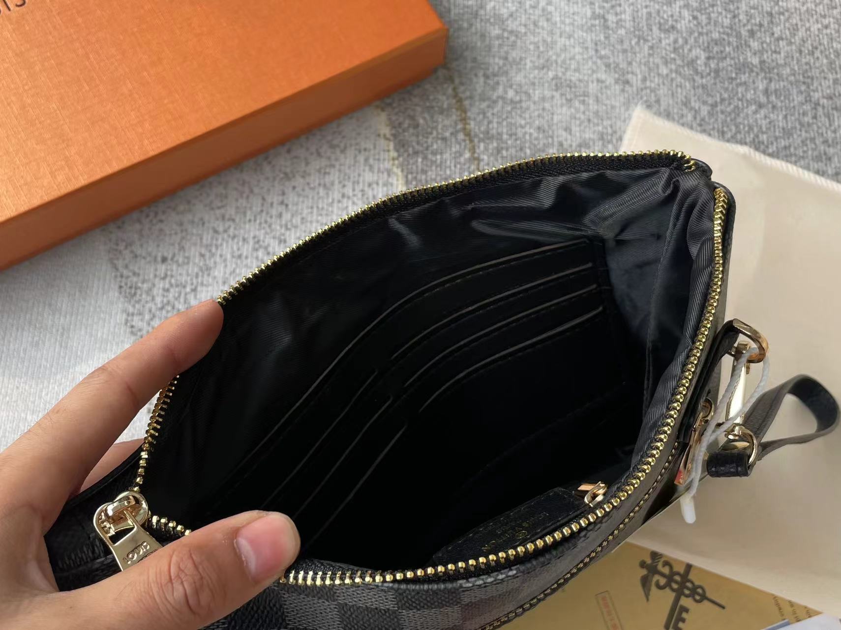 Louis vuitton handbag (wristlet   bag)